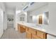 Dual sink bathroom boasting updated fixtures, wooden vanity, ample counter space, and natural light at 9704 Brawley Dr, Las Vegas, NV 89134