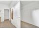 Bathroom with double sinks, wood cabinets, tile flooring, and walk-in closet at 9704 Brawley Dr, Las Vegas, NV 89134