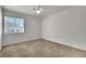 Bedroom with neutral carpet and large window at 9704 Brawley Dr, Las Vegas, NV 89134