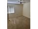 Standard bedroom with neutral carpet, ceiling fan, and a window for natural light at 9704 Brawley Dr, Las Vegas, NV 89134