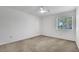 Bedroom with neutral walls and carpet, a ceiling fan, and a window at 9704 Brawley Dr, Las Vegas, NV 89134