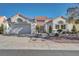 Charming single-story home featuring a well-manicured front yard and a two-car garage at 9704 Brawley Dr, Las Vegas, NV 89134