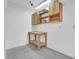 Garage work area featuring upper cabinets, shelving and work table at 9704 Brawley Dr, Las Vegas, NV 89134