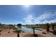 Picturesque golf course view with water feature and lush landscaping under a sunny, blue sky at 9704 Brawley Dr, Las Vegas, NV 89134