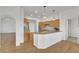 Spacious open kitchen featuring granite countertops, wood cabinets, and hardwood floors at 9704 Brawley Dr, Las Vegas, NV 89134