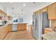 Kitchen featuring stainless steel appliances, granite counters, and breakfast nook at 9704 Brawley Dr, Las Vegas, NV 89134