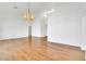Elegant living room with hardwood floors, high ceilings, and a decorative chandelier lighting at 9704 Brawley Dr, Las Vegas, NV 89134