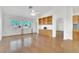 Bright living room with hardwood floors, built-in shelving, a ceiling fan, and a lovely window view at 9704 Brawley Dr, Las Vegas, NV 89134