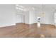 Bright open-plan living area featuring hardwood floors, ceiling fan, and archways at 9704 Brawley Dr, Las Vegas, NV 89134