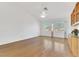 Spacious living room with hardwood floors, a ceiling fan, and a large window for natural light at 9704 Brawley Dr, Las Vegas, NV 89134