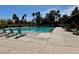 Inviting community swimming pool with lounge chairs and a relaxing atmosphere at 9704 Brawley Dr, Las Vegas, NV 89134