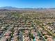Expansive aerial view of a well-planned community with mountain backdrop and neatly arranged homes at 9950 Waxberry Ct, Las Vegas, NV 89178