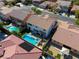 High-angle aerial shot of homes boasting beautiful backyard pools, complemented by lush greenery and privacy at 9950 Waxberry Ct, Las Vegas, NV 89178
