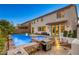Entertainer's backyard with a pool, spa, built-in BBQ, and ample patio space for outdoor gatherings at 9950 Waxberry Ct, Las Vegas, NV 89178