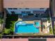 Aerial view highlighting a pool and spa with an outdoor kitchen, creating a perfect backyard retreat at 9950 Waxberry Ct, Las Vegas, NV 89178