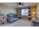Cozy Bedroom with a charming blue crib, matching dresser, and a window with stylish curtains at 9950 Waxberry Ct, Las Vegas, NV 89178