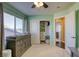 Bright Bedroom with a changing table, closet, and lots of natural light from the large window at 9950 Waxberry Ct, Las Vegas, NV 89178