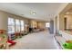 Spacious bonus room with ample natural light, plush carpet, and plenty of space for recreation at 9950 Waxberry Ct, Las Vegas, NV 89178