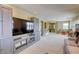 Spacious bonus room featuring a media center, plush carpet, and generous natural lighting at 9950 Waxberry Ct, Las Vegas, NV 89178