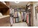 Spacious walk-in closet includes shelving and hanging racks for organization at 9950 Waxberry Ct, Las Vegas, NV 89178