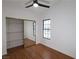 Bright bedroom featuring closet with sliding mirrored doors and ceiling fan at 1009 Upland Blvd, Las Vegas, NV 89107