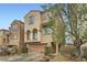 Beautiful two-story home with desert landscaping, and an attached two-car garage at 10808 Holmfield St, Henderson, NV 89052