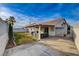 This backyard features a covered patio with outdoor seating and a well-maintained lawn, perfect for entertaining at 1107 Cloudy Day Dr, Henderson, NV 89074