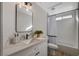 Bathroom with shower-tub combination with sleek fixtures and bright lighting at 1107 Cloudy Day Dr, Henderson, NV 89074