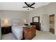 Spacious bedroom features a ceiling fan, carpeted floors, and neutral paint at 1107 Cloudy Day Dr, Henderson, NV 89074