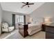 Bedroom with a ceiling fan, carpeted floors, and natural light from the window at 1107 Cloudy Day Dr, Henderson, NV 89074