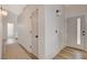 Bright hallway with modern lighting, fresh paint, and a clear view to a stylish bathroom at 1107 Cloudy Day Dr, Henderson, NV 89074