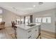 Bright kitchen island view that includes the dining and living areas, creating an ideal space for modern living at 1107 Cloudy Day Dr, Henderson, NV 89074