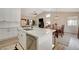 This home offers a kitchen with an island that flows into the dining and living areas perfect for entertaining at 1107 Cloudy Day Dr, Henderson, NV 89074