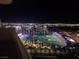 Top Golf Las Vegas with colorful targets, palm trees, and city lights at night, offering entertainment and views at 135 E Harmon Ave # 2120, Las Vegas, NV 89109