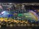 Night view of Topgolf Las Vegas, with brightly lit targets and a panoramic view of the glittering city skyline at 135 E Harmon Ave # 2120, Las Vegas, NV 89109
