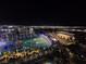 Elevated shot of Topgolf Las Vegas at night, showcasing the colorful targets and illuminated cityscape in the background at 135 E Harmon Ave # 2120, Las Vegas, NV 89109