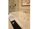 Elegant soaking tub with jets and modern fixtures in bathroom provides a spa-like experience at 135 E Harmon Ave # 2120, Las Vegas, NV 89109