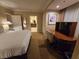 Relaxing bedroom showcases a king bed, stylish desk area, and an ensuite bathroom for added convenience at 135 E Harmon Ave # 2120, Las Vegas, NV 89109
