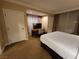 Bedroom with a spacious layout including a king-size bed, desk, and neutral decor throughout the room at 135 E Harmon Ave # 2120, Las Vegas, NV 89109