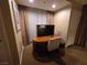 Desk and chair in a room with a window and curtains at 135 E Harmon Ave # 2120, Las Vegas, NV 89109