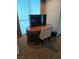 Cozy desk area with a modern TV setup by the window for comfortable working at 135 E Harmon Ave # 2120, Las Vegas, NV 89109