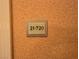 Sign displaying unit number 21720, mounted on a textured wall next to a door frame at 135 E Harmon Ave # 2120, Las Vegas, NV 89109
