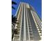 Towering building features wrap-around balconies and expansive windows offering stunning city views at 135 E Harmon Ave # 2120, Las Vegas, NV 89109