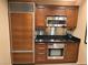 Compact kitchen showcasing modern stainless steel appliances and sleek countertops at 135 E Harmon Ave # 2120, Las Vegas, NV 89109