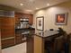 Kitchen area boasts stainless steel appliances, dark countertops, and a breakfast bar at 135 E Harmon Ave # 2120, Las Vegas, NV 89109