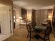 Inviting living area with a dining table set, sofa, and sophisticated decor at 135 E Harmon Ave # 2120, Las Vegas, NV 89109