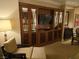 Close-up of living room with comfortable armchair and a media center at 135 E Harmon Ave # 2120, Las Vegas, NV 89109