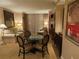 Comfortable living area featuring a dining table, sofa, accent chairs, and elegant lighting at 135 E Harmon Ave # 2120, Las Vegas, NV 89109