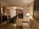This living room combines comfort and style, with a view of the dining area and kitchen at 135 E Harmon Ave # 2120, Las Vegas, NV 89109