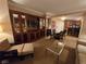 Living room features a built-in entertainment center and seating with dining area at 135 E Harmon Ave # 2120, Las Vegas, NV 89109